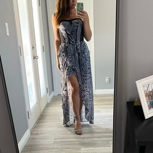 Rare Bebe Addictions strapless, flowy dress with mesh siding.  Size small